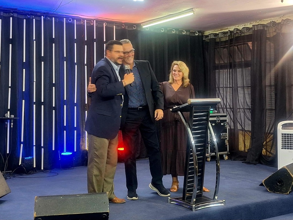 Hal and Pamela Santos serving together on stage